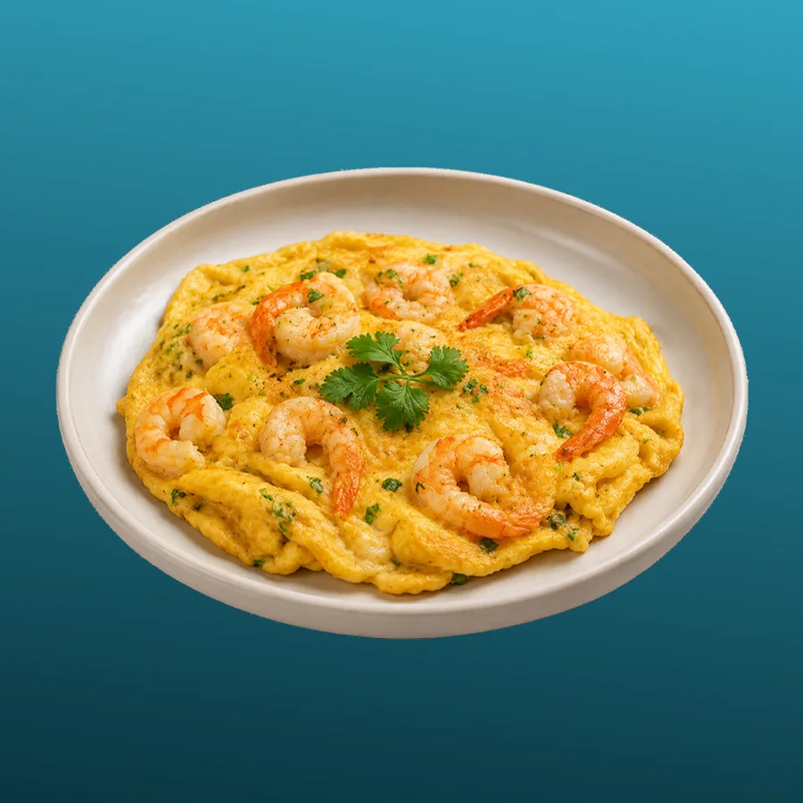 Omelette Crevettes Ail — Omelette moelleuse aux crevettes et à l'ail, servie bien chaude. · Sphère Restaurant by Léa, Kouba, Alger